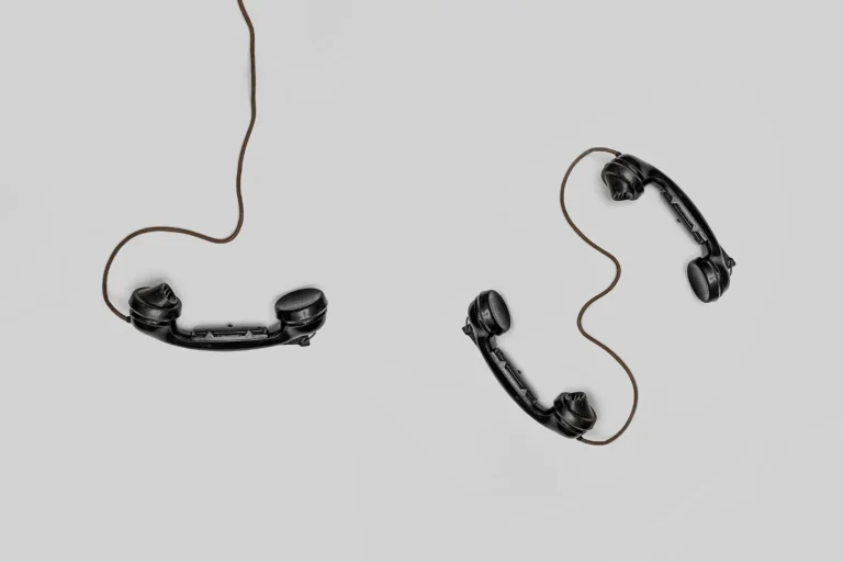 Traditional Black phone handset on a white background.