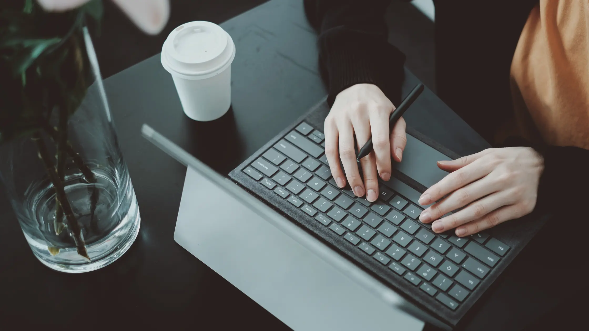 Applicant typing a resume to align with What Recruiters Look for in a Resume.